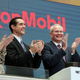 Exxon Chairman and CEO Darren Woods joins the applause during opening bell ceremonies at the New York Stock Exchange.